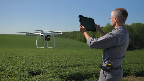 agronomist operating a drone for agricultural survey