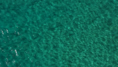 Aerial-view-of-clear-water-rippling-in-the-ocean-currents