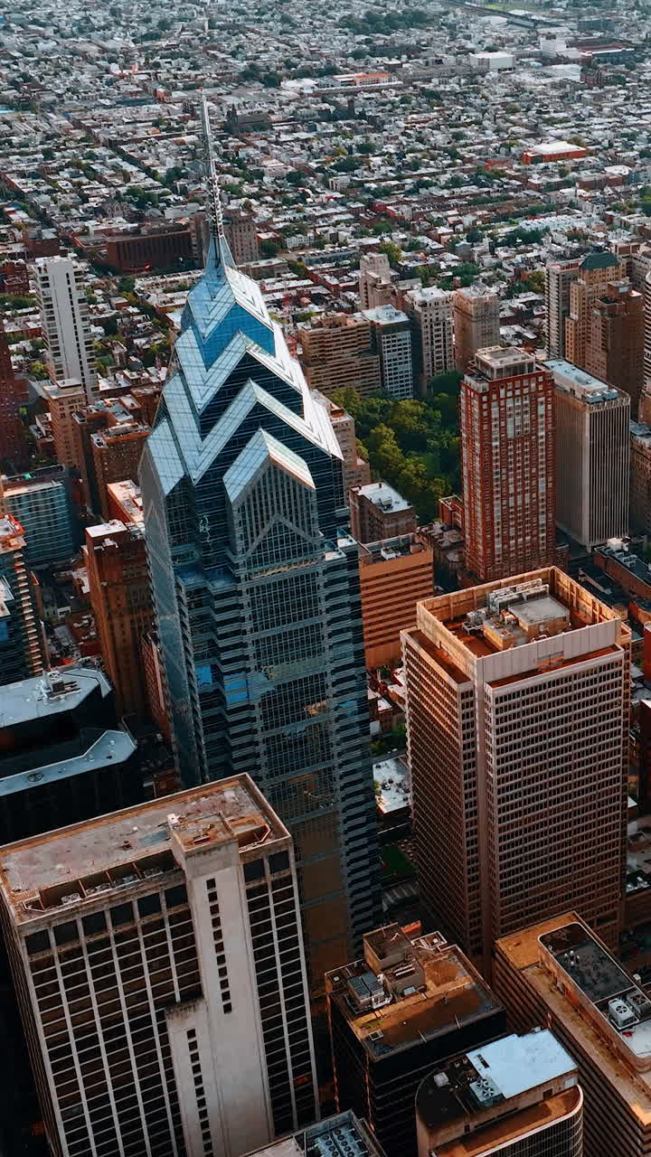 Downtown of Philadelphia from top view. Amazing skyscrapers shining in the sun. Cityscape at backdrop. Vertical video