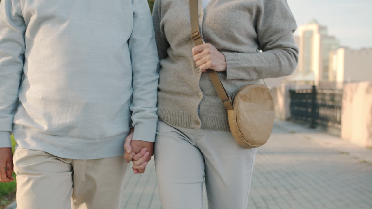 Older Couple Walking Hand-in-Hand