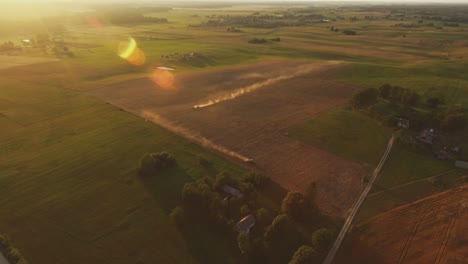 Heavy-Agricultural-Machinery-In-Agricultural-Fields-On-A-Sunny-Summer-Evening