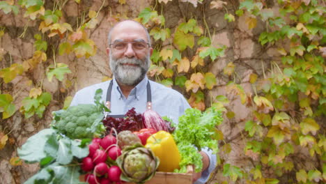 farmer with a fresh harvest of vegetables