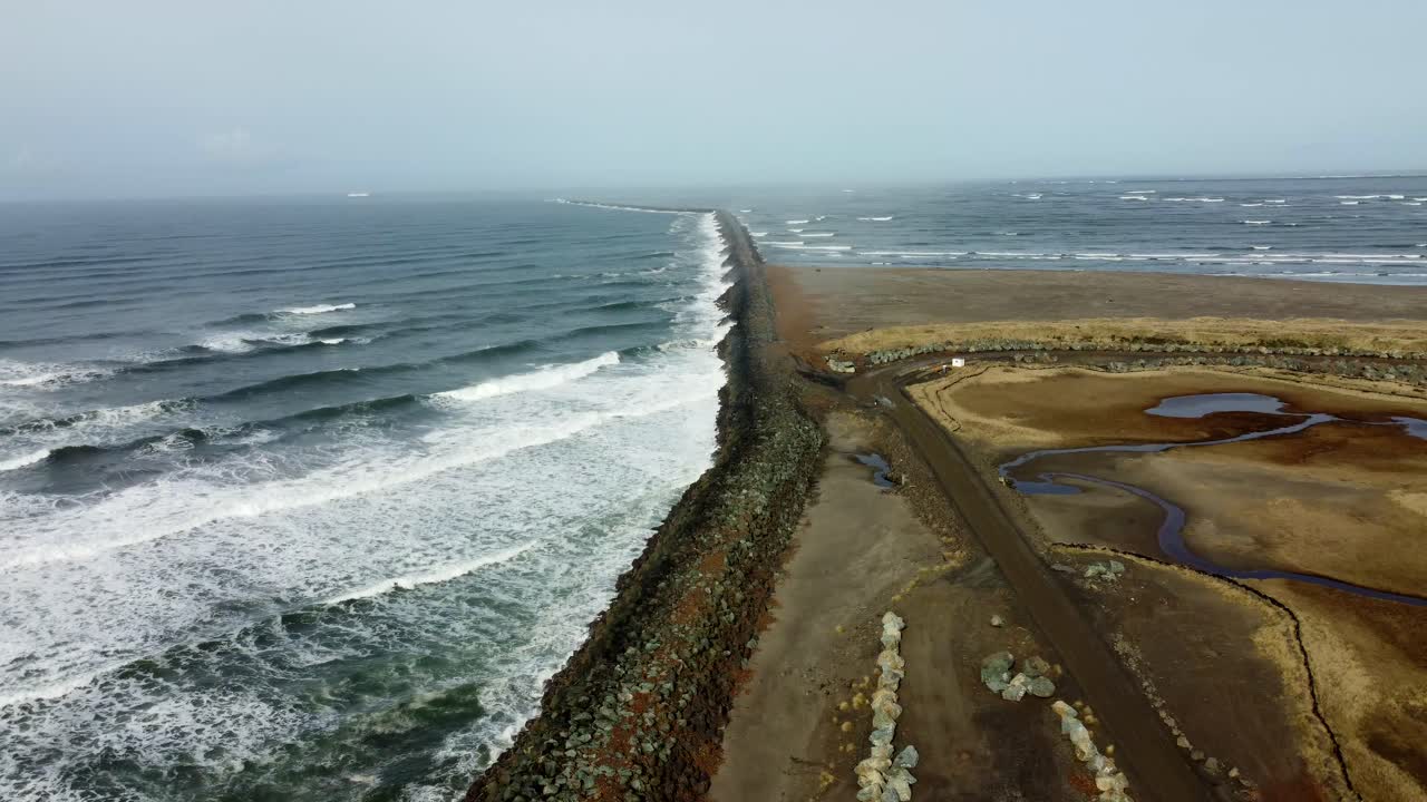 US, Oregon, Astoria, Fort Stevens, 2025-03-21 - Drone view of the northwest tip of Oregon where the Columbia River meets the Pacific Ocean. The jetty protects the river entrance.