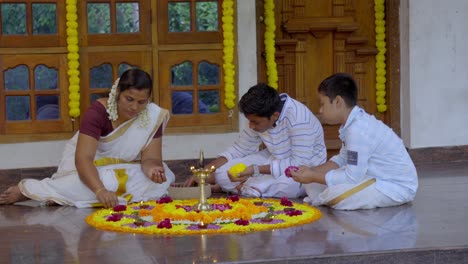 athapookkalam decorating for onam festival in kerala ,pookalam decorating kerala traditional family for onam celebration