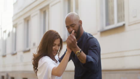 interracial couple dancing bachata in the old town street 9