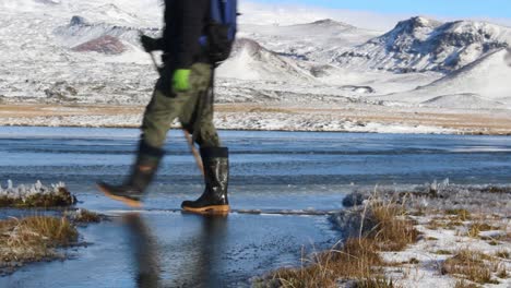 Walking-over-a-plank-over-a-frozen-stream