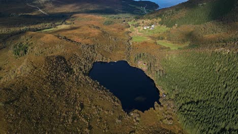 aerial over the lakes and rugged and hills near lauvstad in the volda municipality, norway