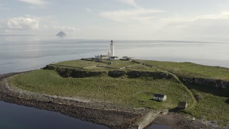 aerial view of pladda lighthouse on the isle of arran on a sunny day, scotland