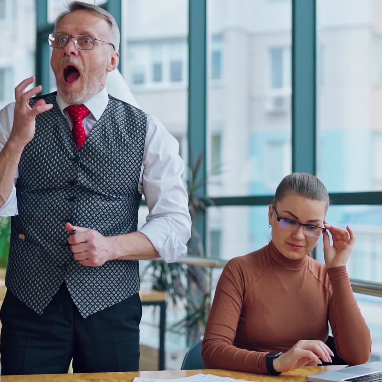 Secretary and her mature boss in office. Senior businessman puts document on the desk angrily and feels ashamed. Slow motion.