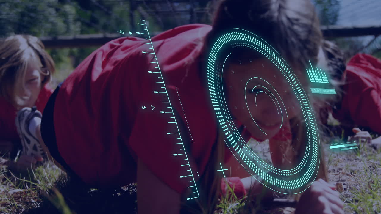 Crawling through grass, children with digital target animation overlay outdoors