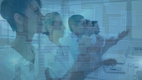 Diverse group working on computers with binary code overlay animation