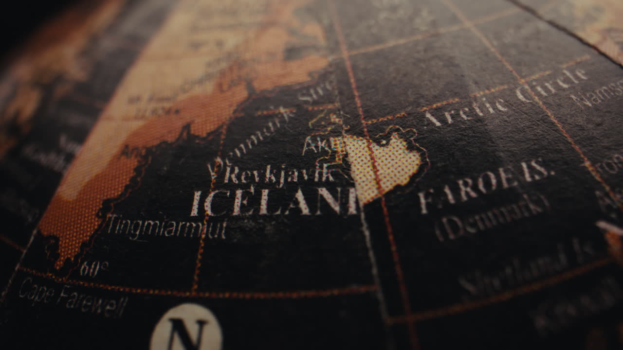 Close-up of an old globe showing Iceland and the Faroe Islands