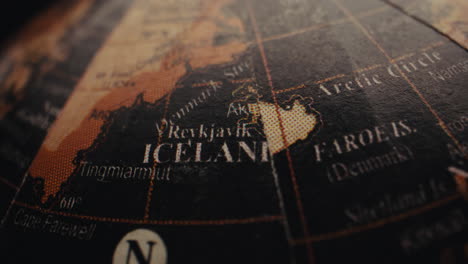 close-up of an old globe showing iceland and the faroe islands