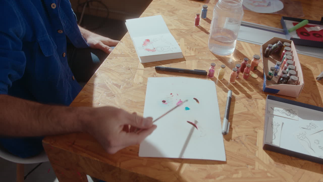 Artist Mixing Dry Pigments with Water and Going to Paint a Picture