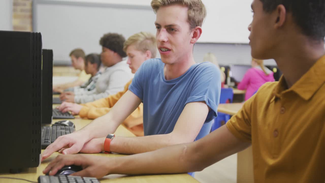 Students working on computers in high school class