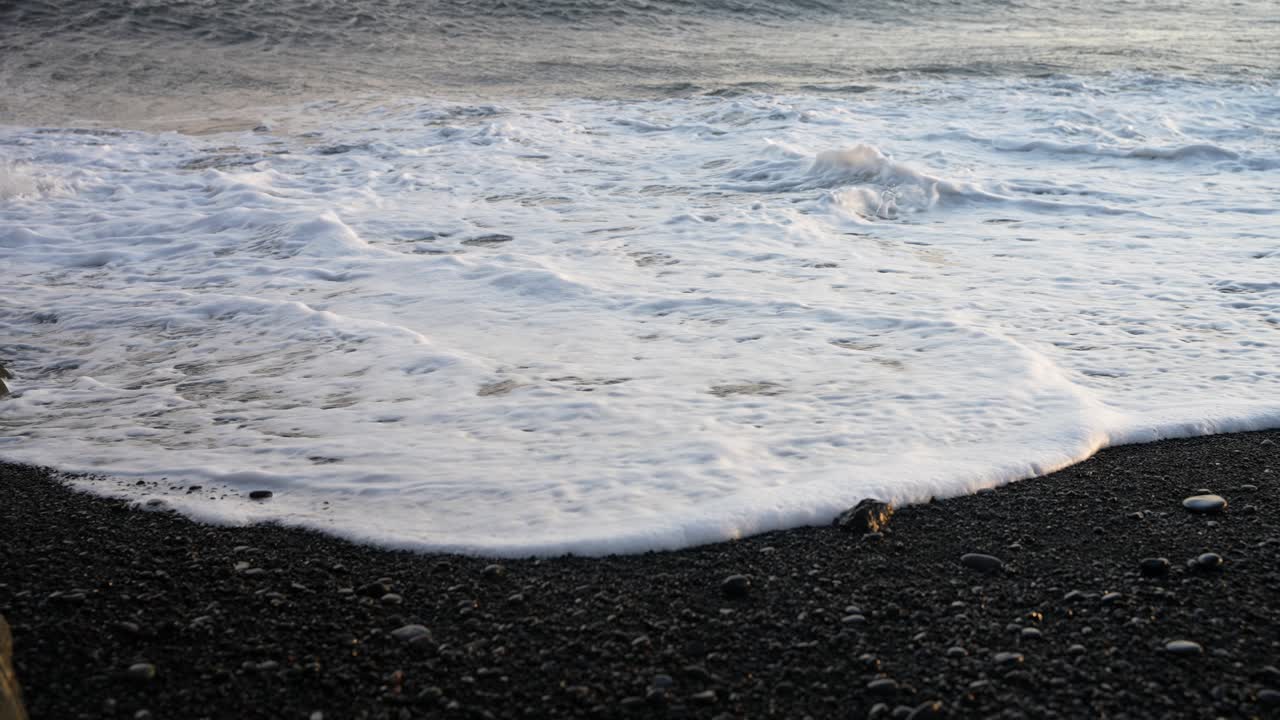 waves and it's dissapearence on the black sand beach, slow motion, Iceland
