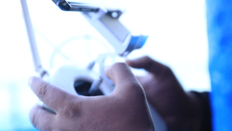 a man takes a video with a drone on a boat at sea