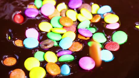 vibrant candies scattered over rich chocolate