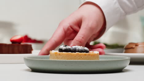 chef presenting a fruit tart