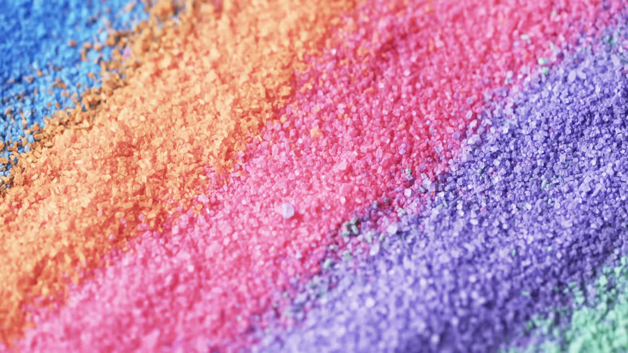 video de primer plano de los granos de arena de color arco iris y copia del fondo del espacio