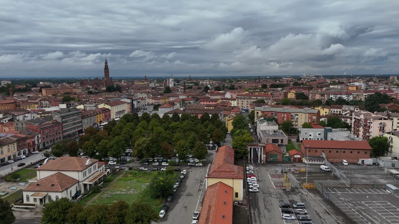 Cremona cityscape with historical buildings and the iconic Torrazzo bell tower, showing the urban skyline of the Lombardy region in Italy, an aerial view of the city