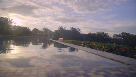 beautiful view of a swimming pool in natural environment at sunset in boca, chica, panama