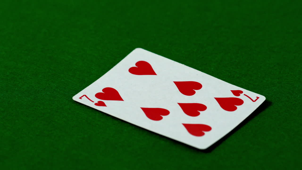 Seven of hearts falling on casino table