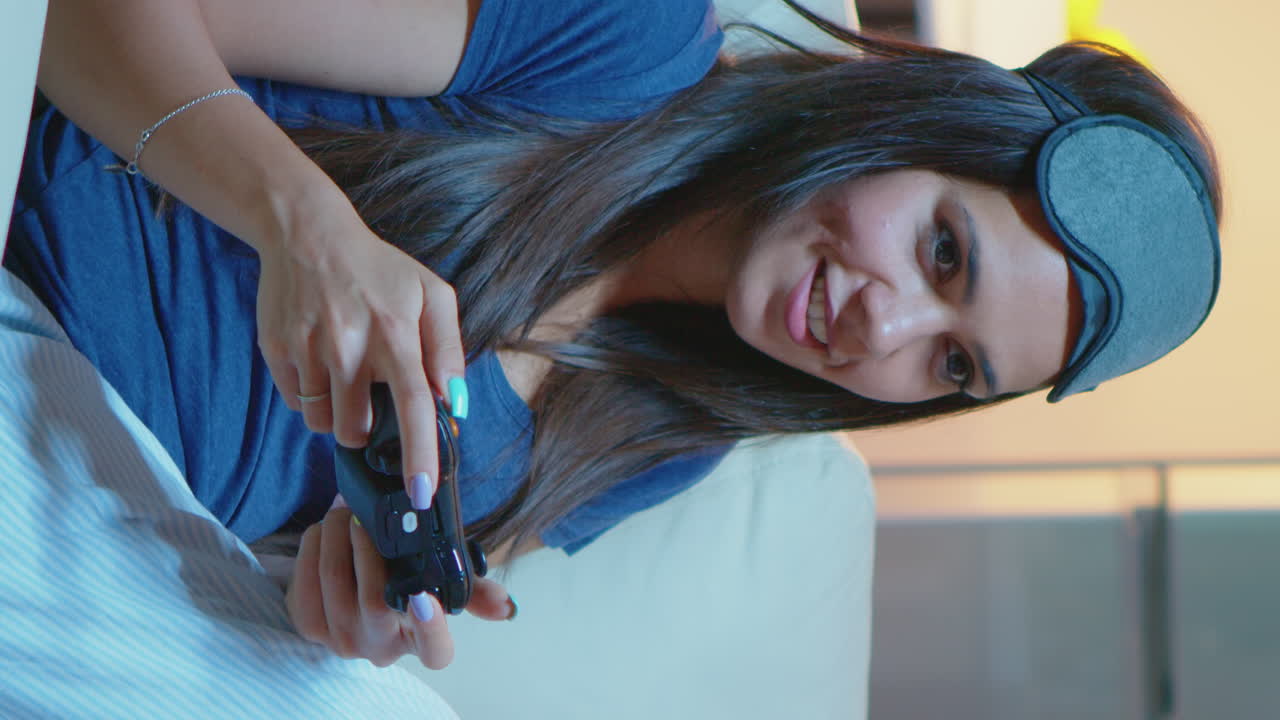 Vertical Video: Gamer Using Joystick Playing Video Games