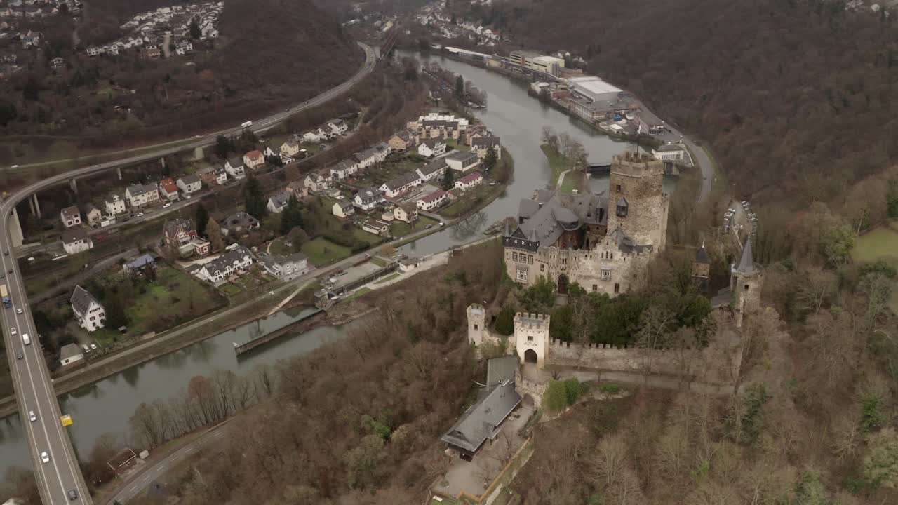 Aerial View of a Castle and Town Along a River