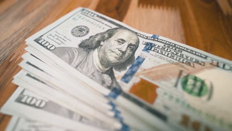 President-Franklin-one-hundred-dollar-bills-panning-shot-close-up