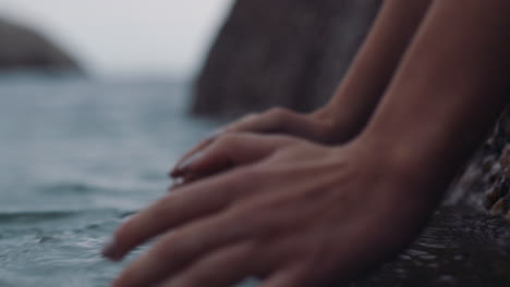 close up hands holding water thirsty person drinking from fresh river