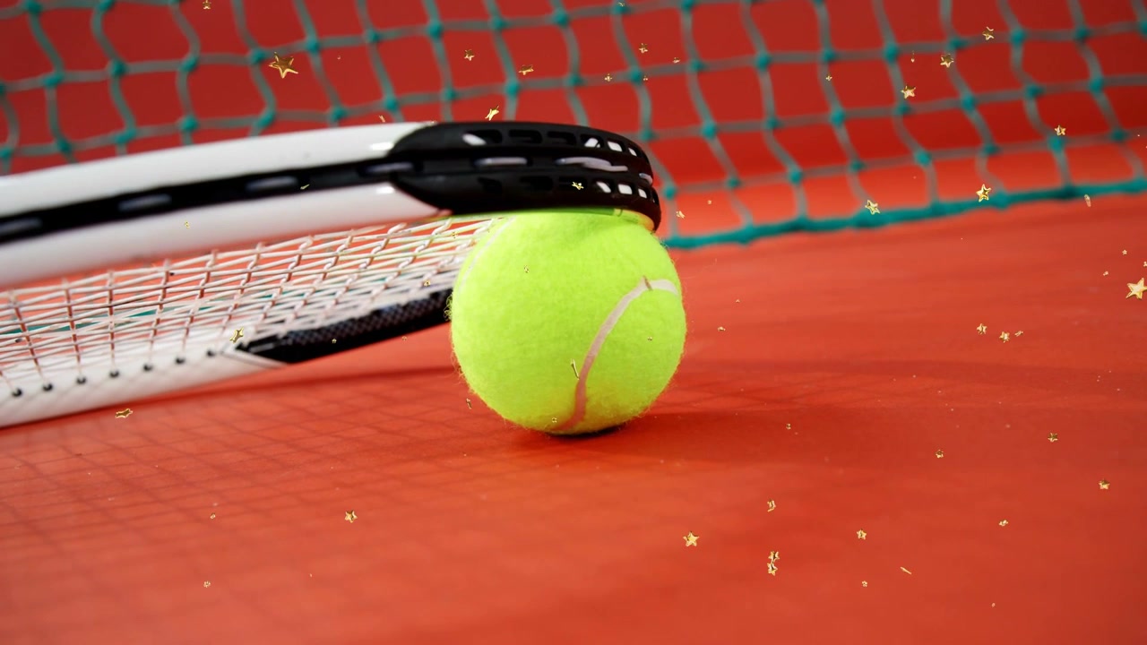 Racket lifting and revealing yellow tennis ball rolling toward green net with gold stars for sports