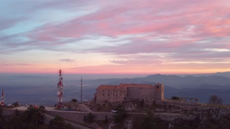 Beautiful-Sunset-Over-Santuari-de-la-Mare-de-Déu-del-Mont,-Mountain-Top:-The-Highest-Majestic-Peak-of-Alta-Garrotxa-range-in-the-Spanish-Pyrenees-Mountains,-Catalonia