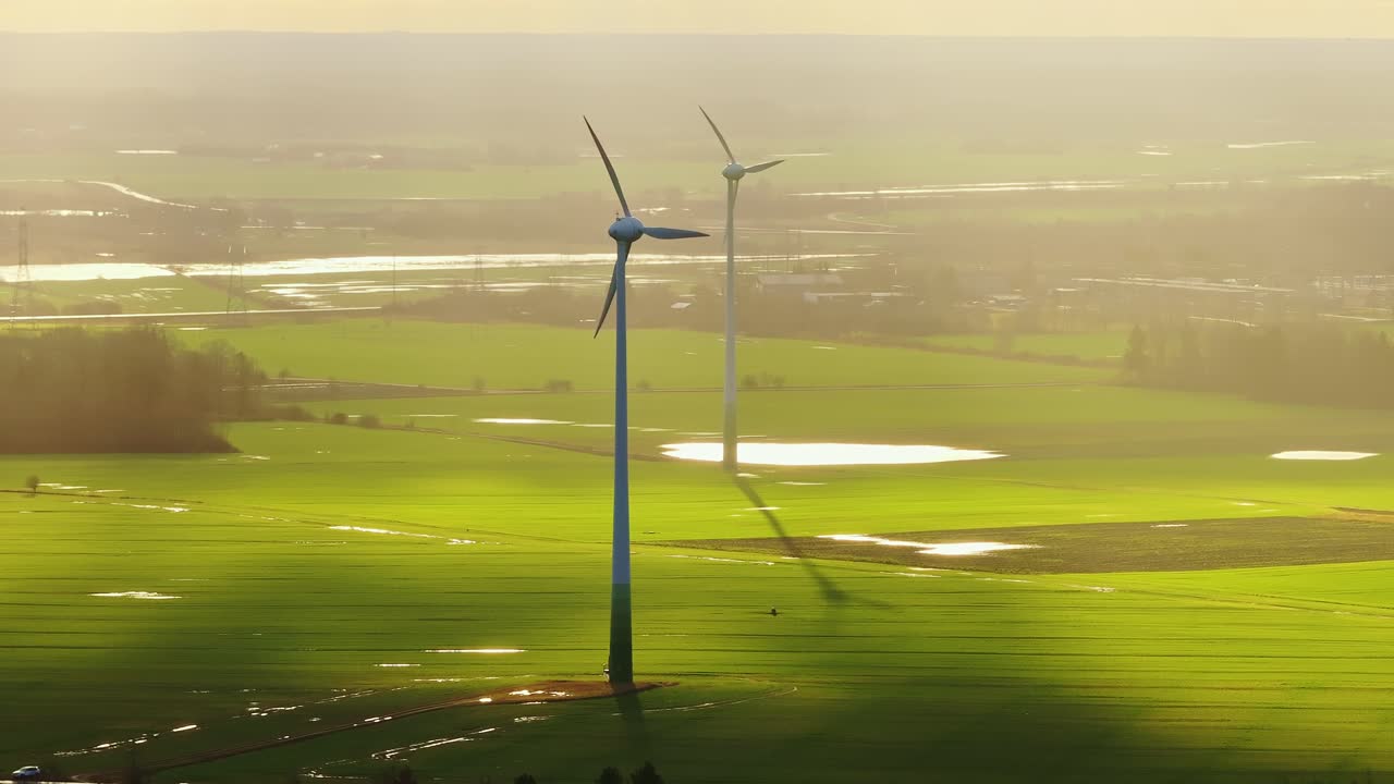Grobiņa Wind Park near Liepāja, turbine and cloud shadows, morning light, drone