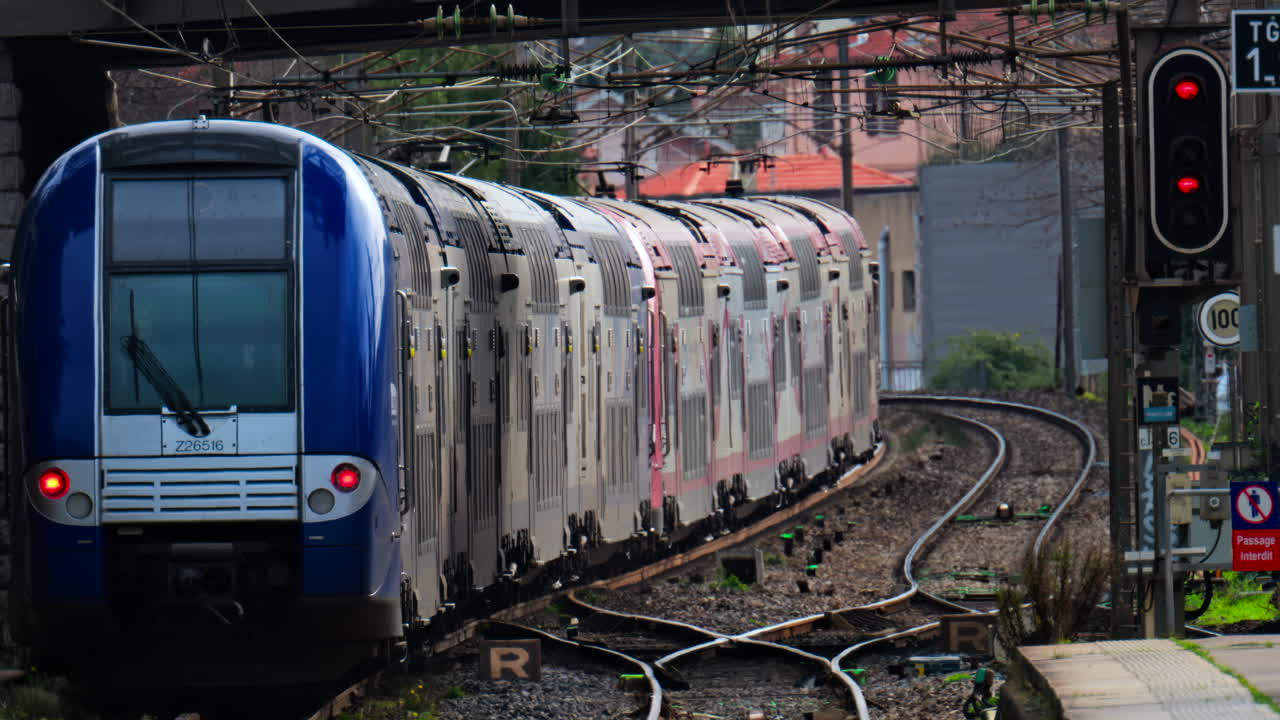 Trains moving on the rails near a train station in Antibes, France