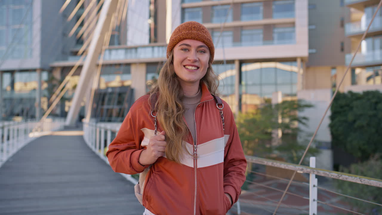 Woman smiling on a bridge