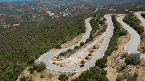 Car-Driving-On-Hairpin-Turn-By-Mountain-Pass-In-Peloponnese-Region,-Greece