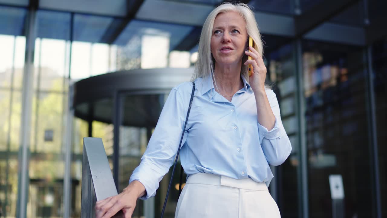 Businesswoman on a Phone Call Outside an Office Building