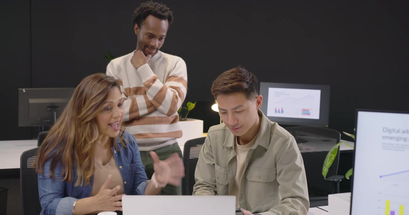 Diverse Team Collaborating on a Project in a Modern Office