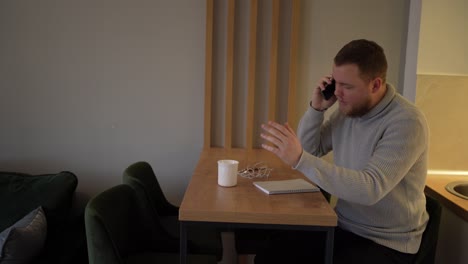 young male having a call, arguing