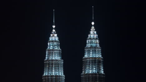 timelapse of illuminated petronas twin towers kuala lumpur