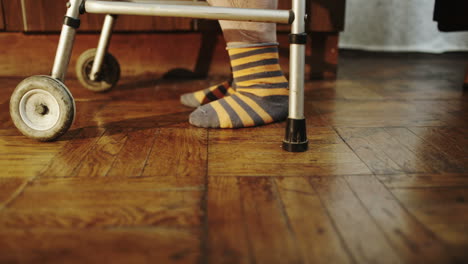 old woman making hard way with walker