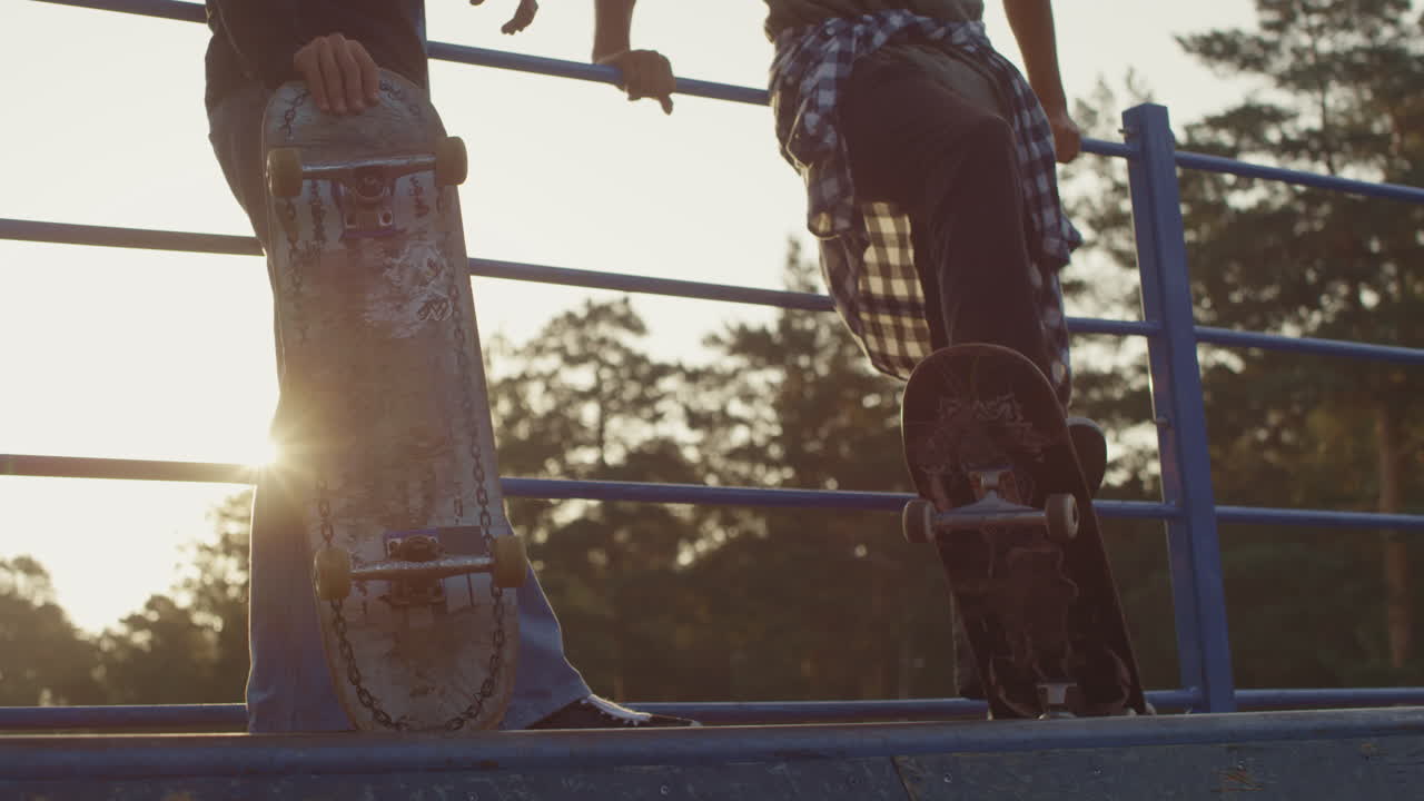Unrecognizable Guys with Skateboards Chatting