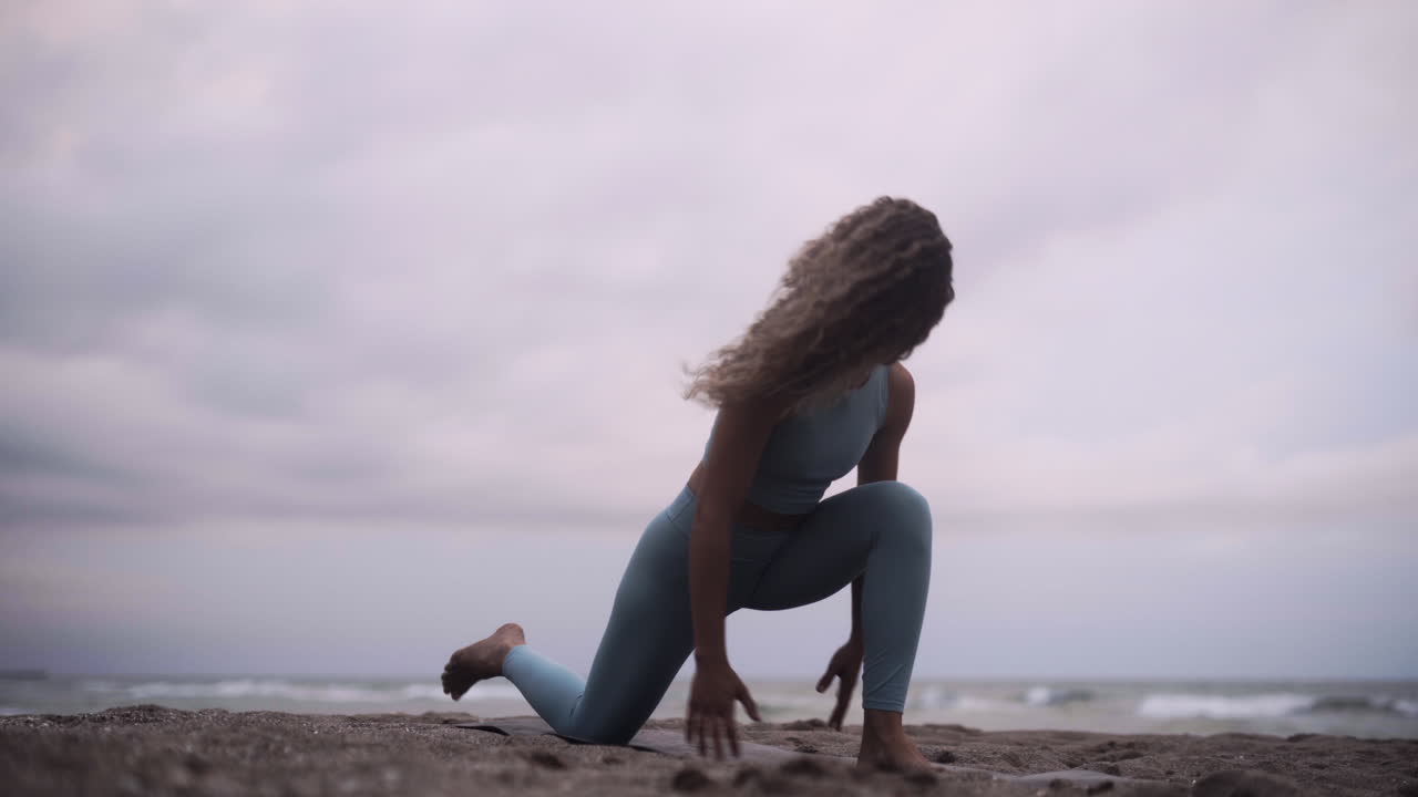 Connection to god practicing Yoga Barcelona beach Spain
