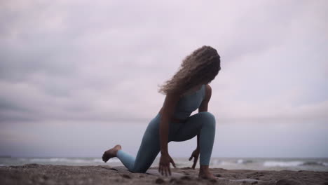 Connection-to-god-practicing-Yoga-Barcelona-beach-Spain