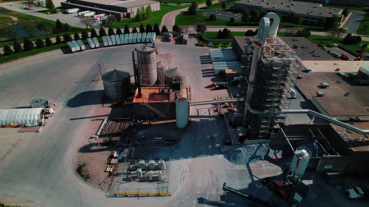Industrial facility featuring processing towers, silos, and heavy machinery in North Wisconsin.