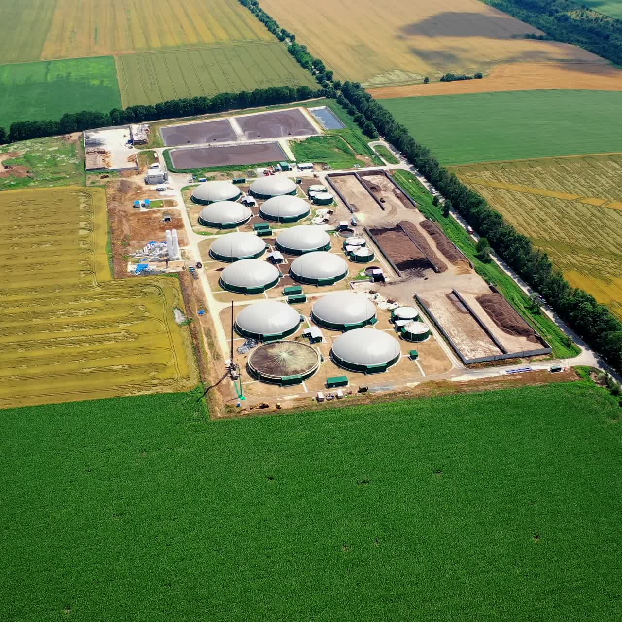 Bio gas station. Modern biofuel factory. Aerial view on biofuel plant. Ecological production concept. Video from above