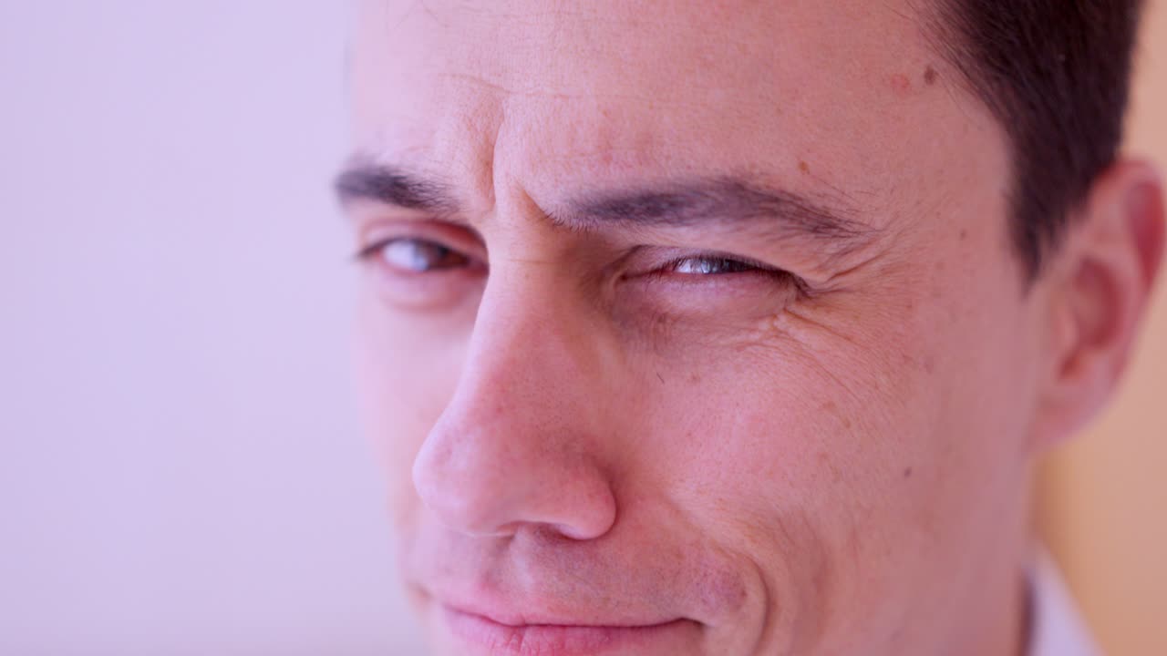 Charismatic man smiling and making facial expressions