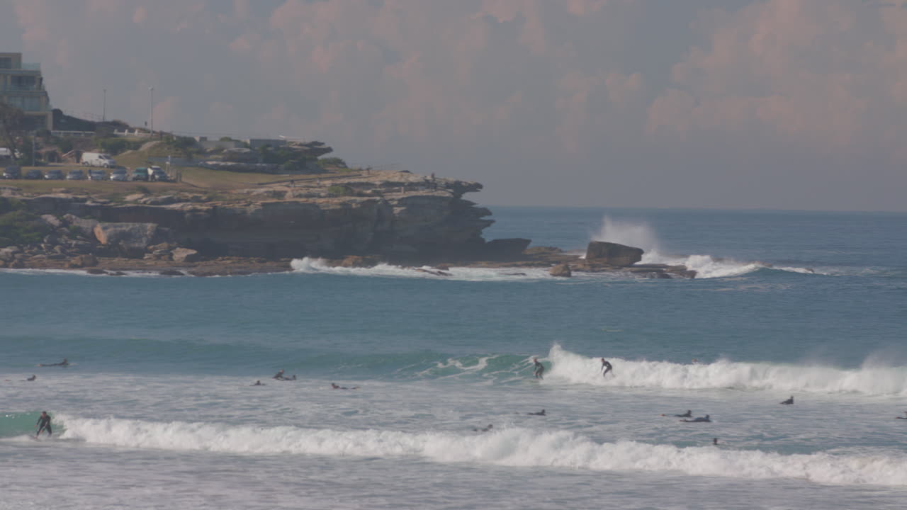 A Surfer manages to catch a huge wave in sydney Australia