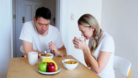 happy couple having breakfast